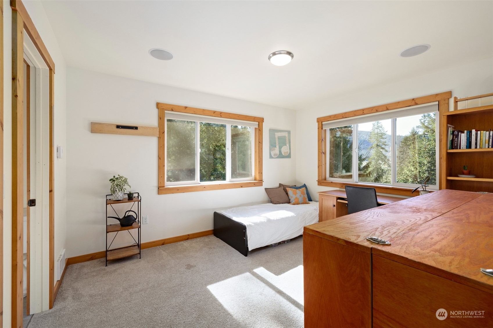 3956 Happy Valley Road Sequim, WA 98382 - Photo 37 of 40 a living room with couches and a large window with garden view