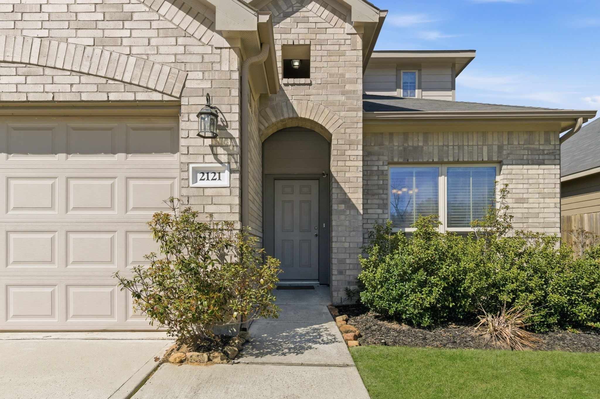 2121 Cedar Way Drive Conroe, TX 77301 - Photo 2 of 27 a front view of a house with garden