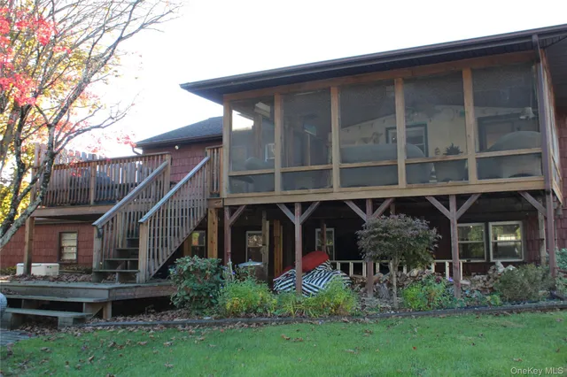 a front view of house with a garden