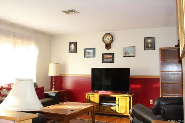 a room with furniture and a flat screen tv