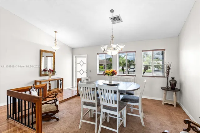 a view of a dining room with furniture window and outside view