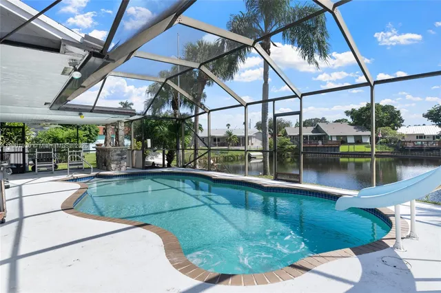 a view of a swimming pool with a porch in front of it