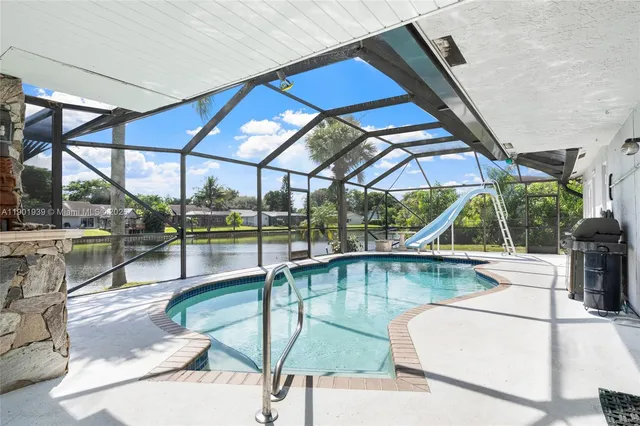 a view of a swimming pool with a patio