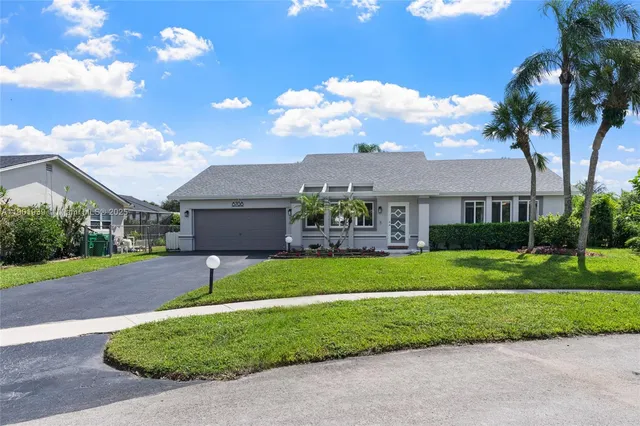 front view of a house with a yard