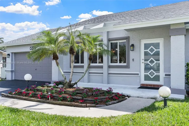 a front view of a house with yard