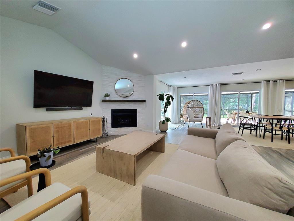 6522 Hidden Beach Circle Orlando, FL 32819 - Photo 14 of 65 a living room with furniture and a flat screen tv