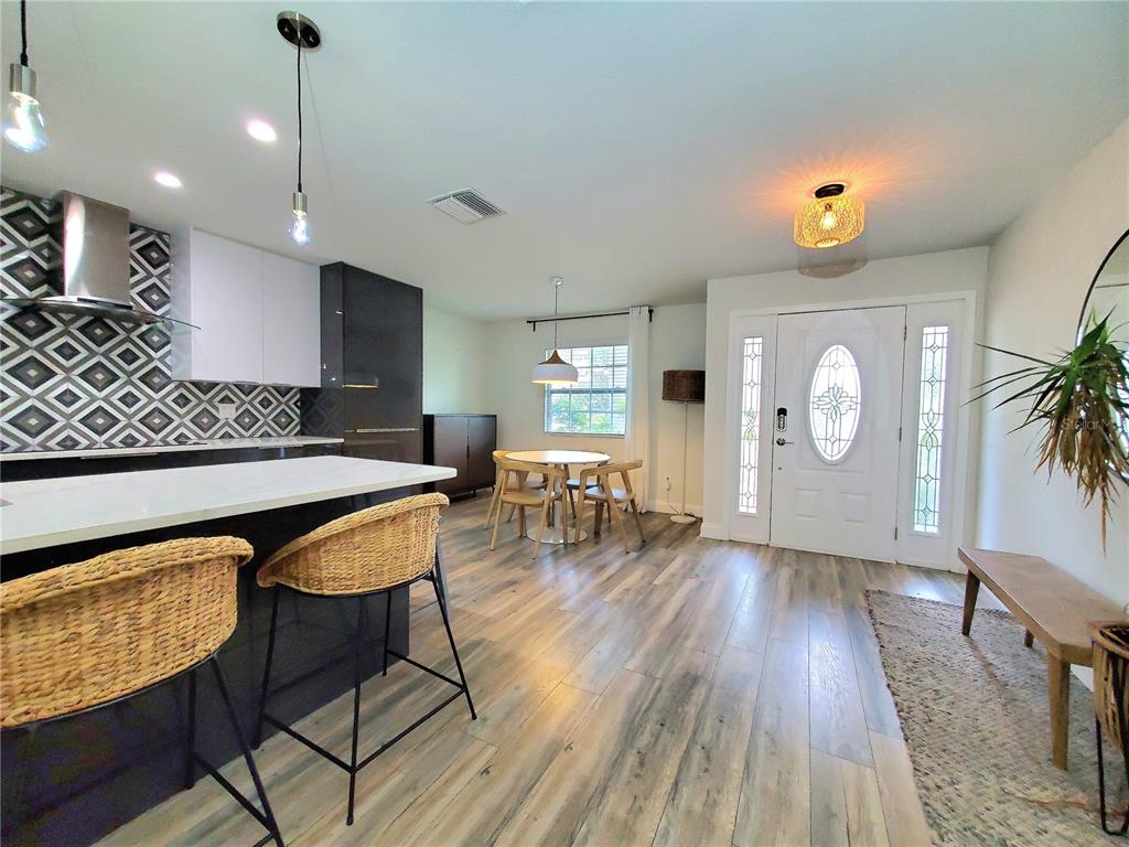 6522 Hidden Beach Circle Orlando, FL 32819 - Photo 16 of 65 a living room with furniture and a wooden floor