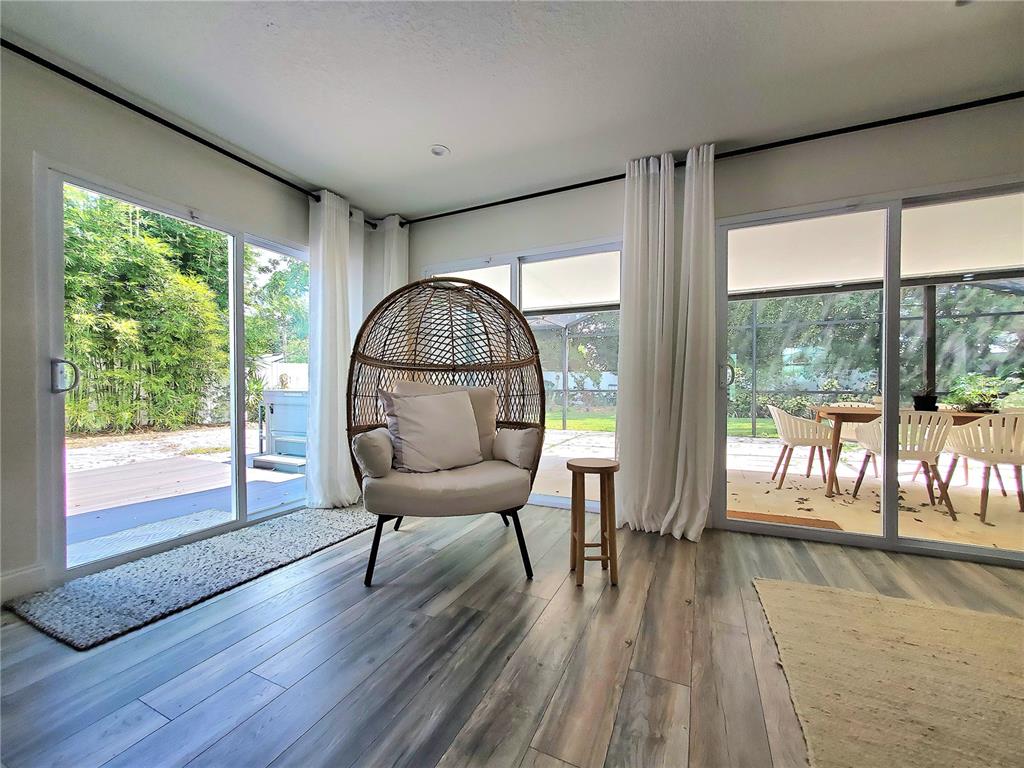 6522 Hidden Beach Circle Orlando, FL 32819 - Photo 20 of 65 a view of a livingroom with furniture wooden floor wooden floor and windows
