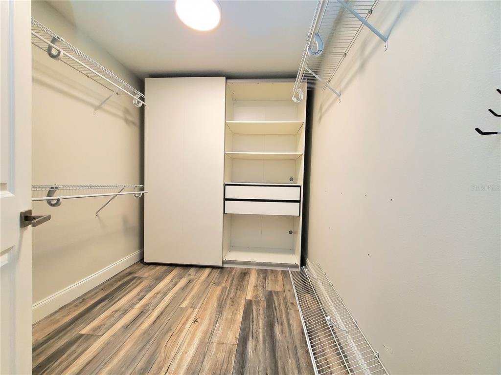 6522 Hidden Beach Circle Orlando, FL 32819 - Photo 26 of 65 a view of a room with wooden floor and door