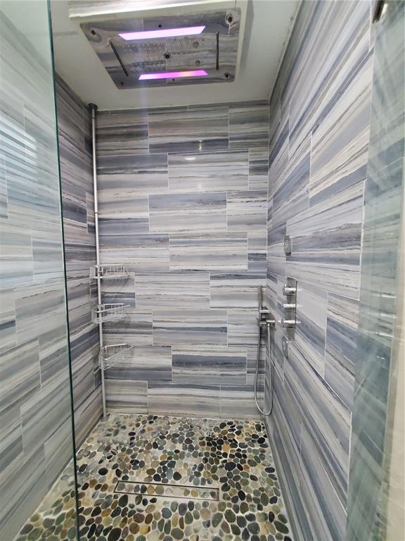 6522 Hidden Beach Circle Orlando, FL 32819 - Photo 30 of 65 a bathroom with a shower