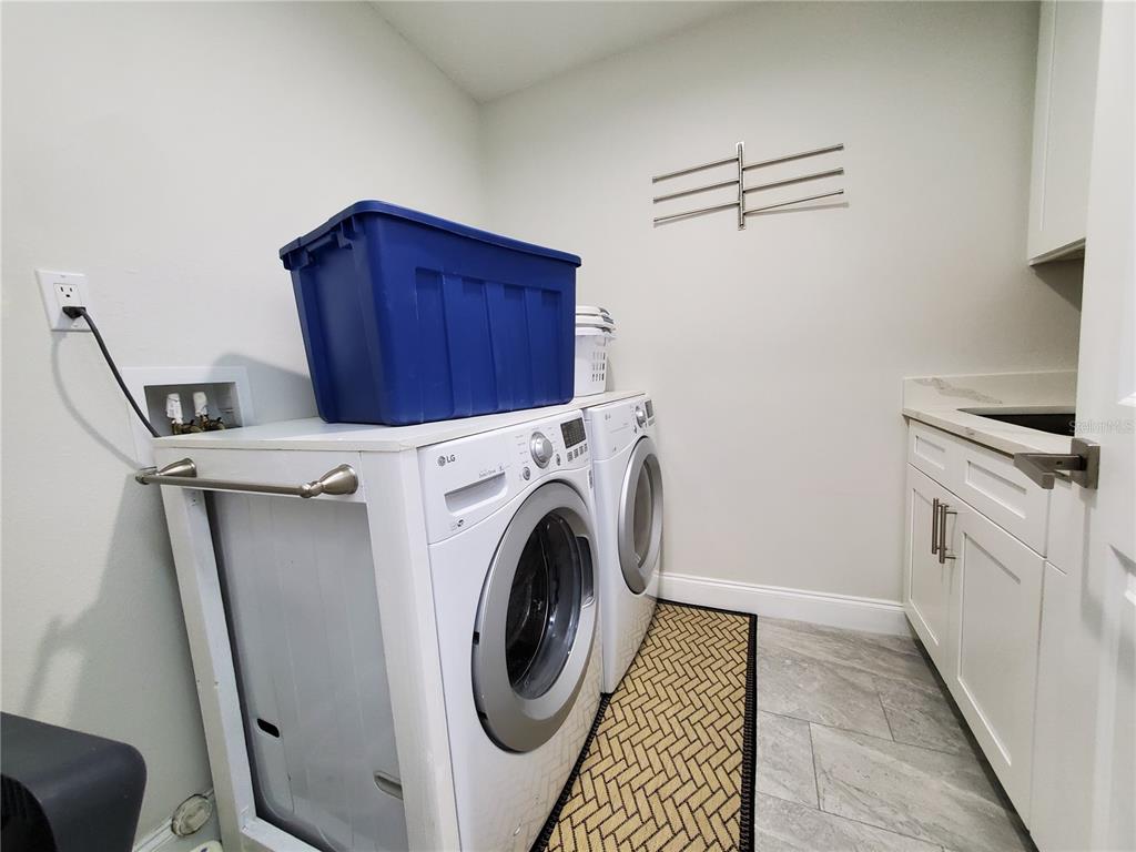 6522 Hidden Beach Circle Orlando, FL 32819 - Photo 35 of 65 a utility room with dryer and washer