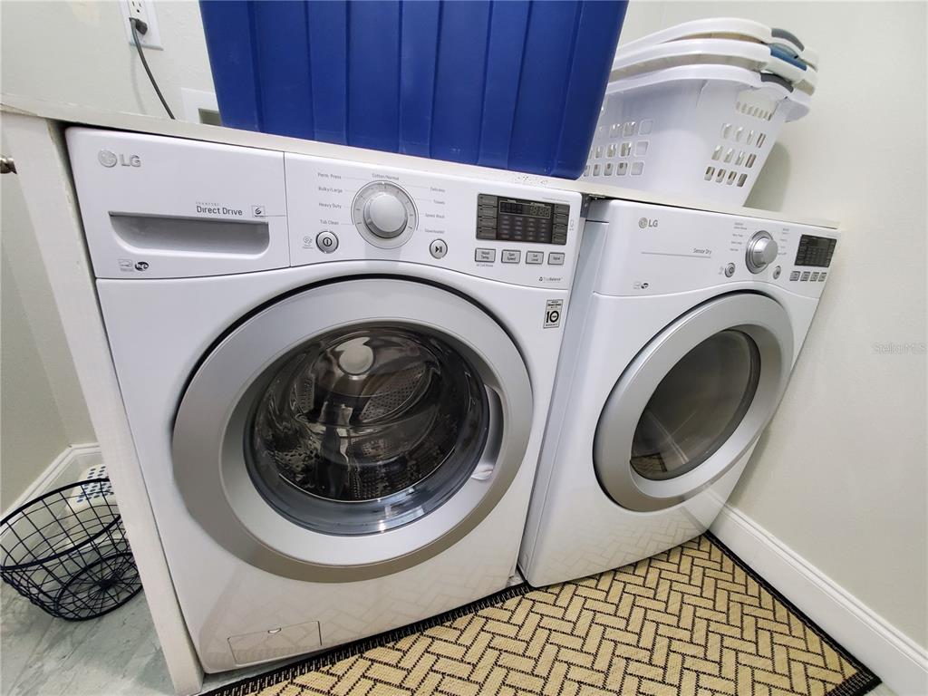 6522 Hidden Beach Circle Orlando, FL 32819 - Photo 37 of 65 a utility room with dryer and washer