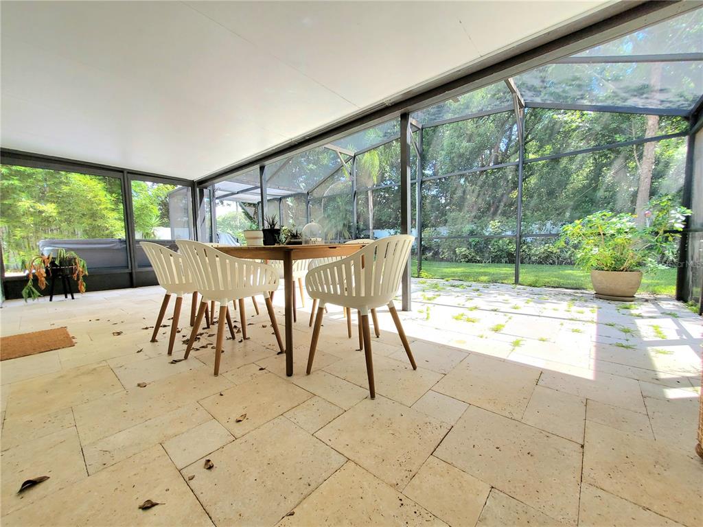 6522 Hidden Beach Circle Orlando, FL 32819 - Photo 51 of 65 a view of a patio with a dining table and chairs