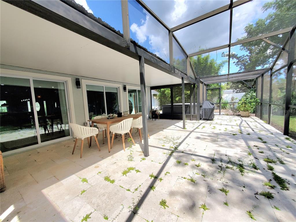 6522 Hidden Beach Circle Orlando, FL 32819 - Photo 54 of 65 a view of a patio with a table and chairs