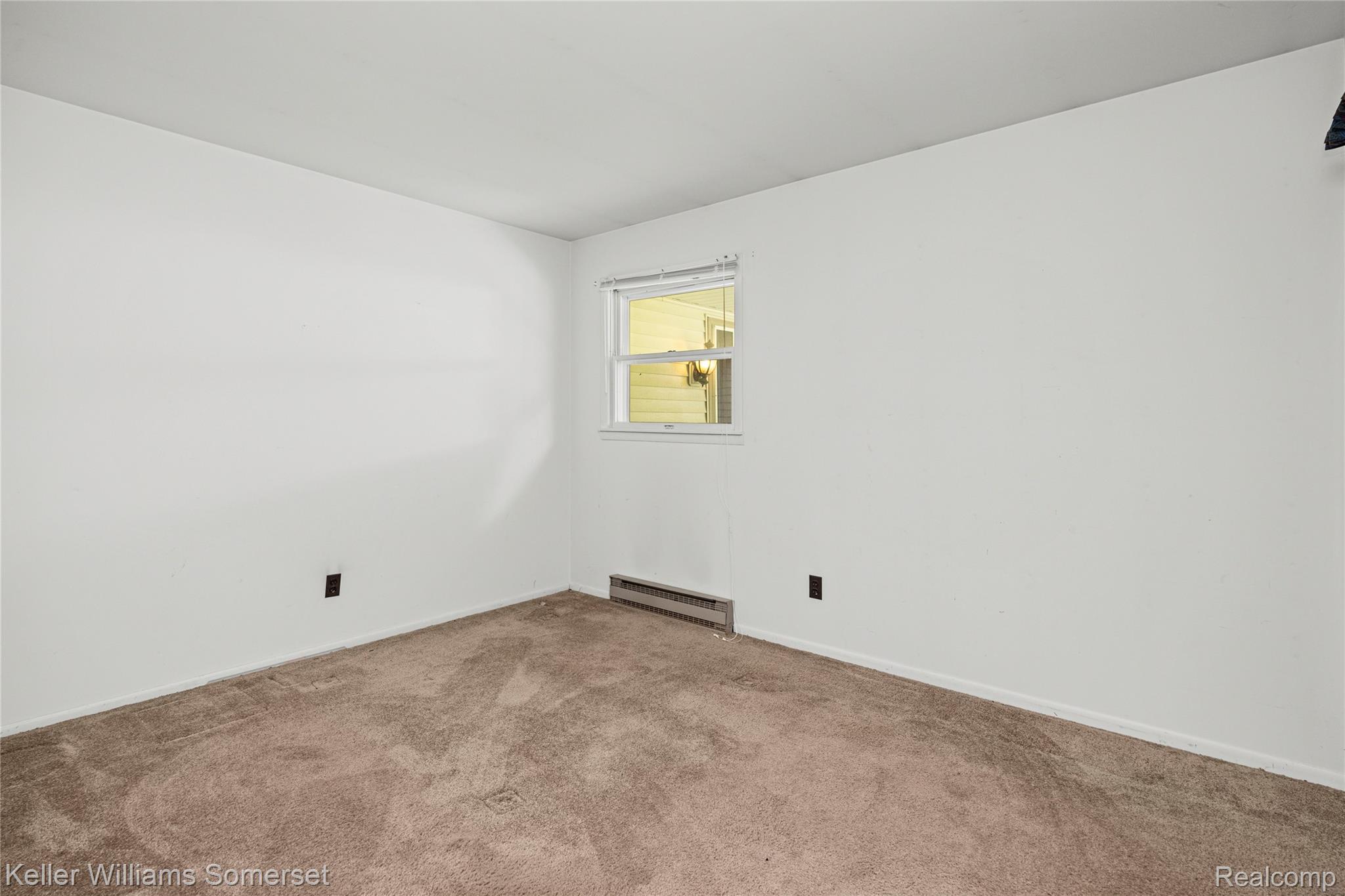 2344 Rochester Road Leonard, MI 48367 - Photo 30 of 66 Neutral-toned carpet flooring and white painted walls