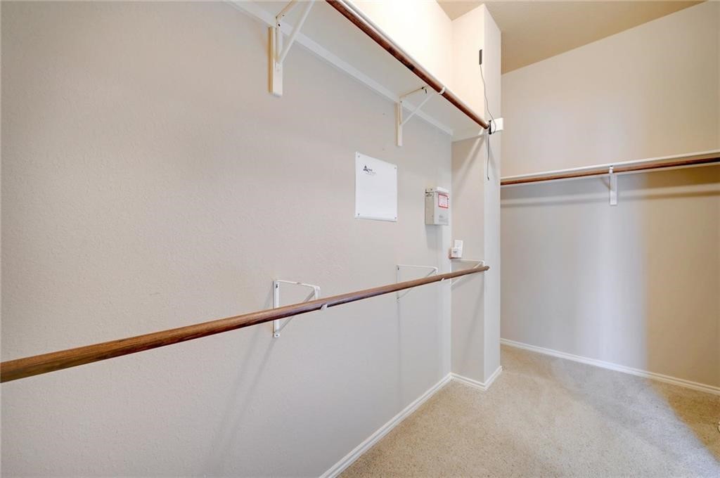 932 Rusk Road Round Rock, TX 78665 - Photo 27 of 33 primary bedroom's walk-in closet.