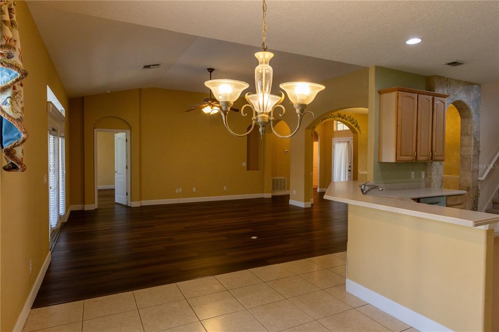 65 Calliope Street Ocoee, FL 34761 - Photo 13 of 60 a kitchen with a sink and cabinets