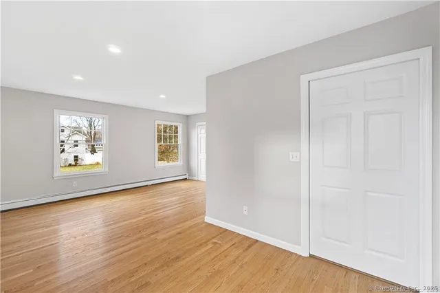 a view of a pathway with a wooden fence