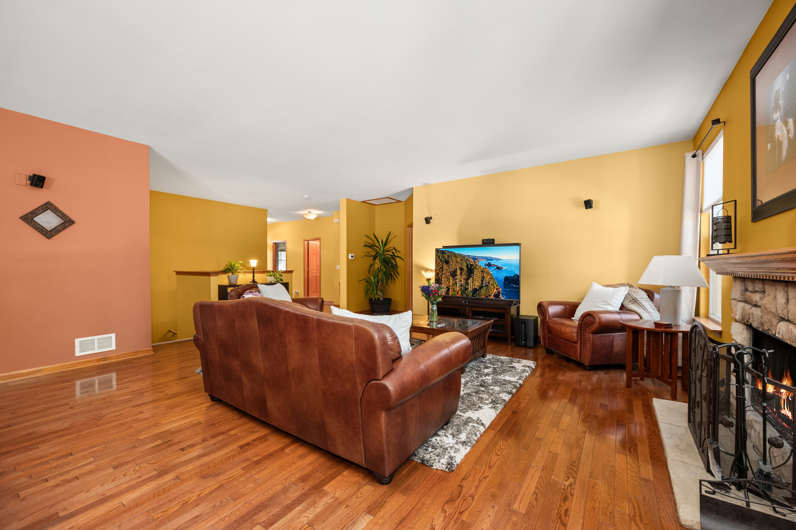 214 Stearn Drive Genoa, IL 60135 - Photo 14 of 24 a living room with furniture and a flat screen tv