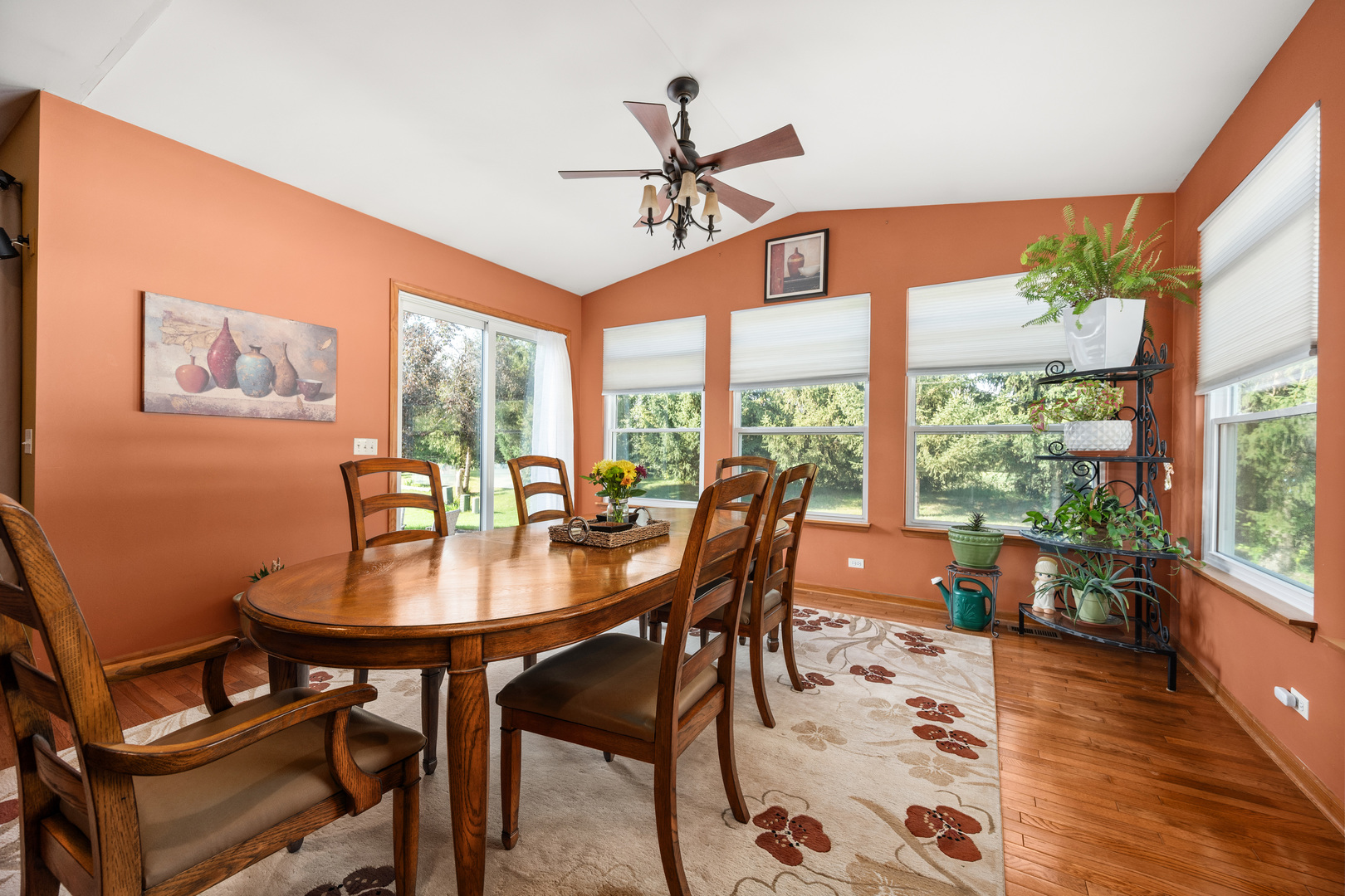 214 Stearn Drive Genoa, IL 60135 - Photo 16 of 24 a dining room with furniture a chandelier and wooden floor