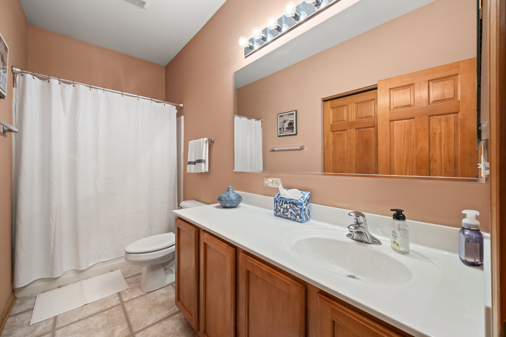 214 Stearn Drive Genoa, IL 60135 - Photo 7 of 24 a bathroom with a double vanity sink toilet and a mirror