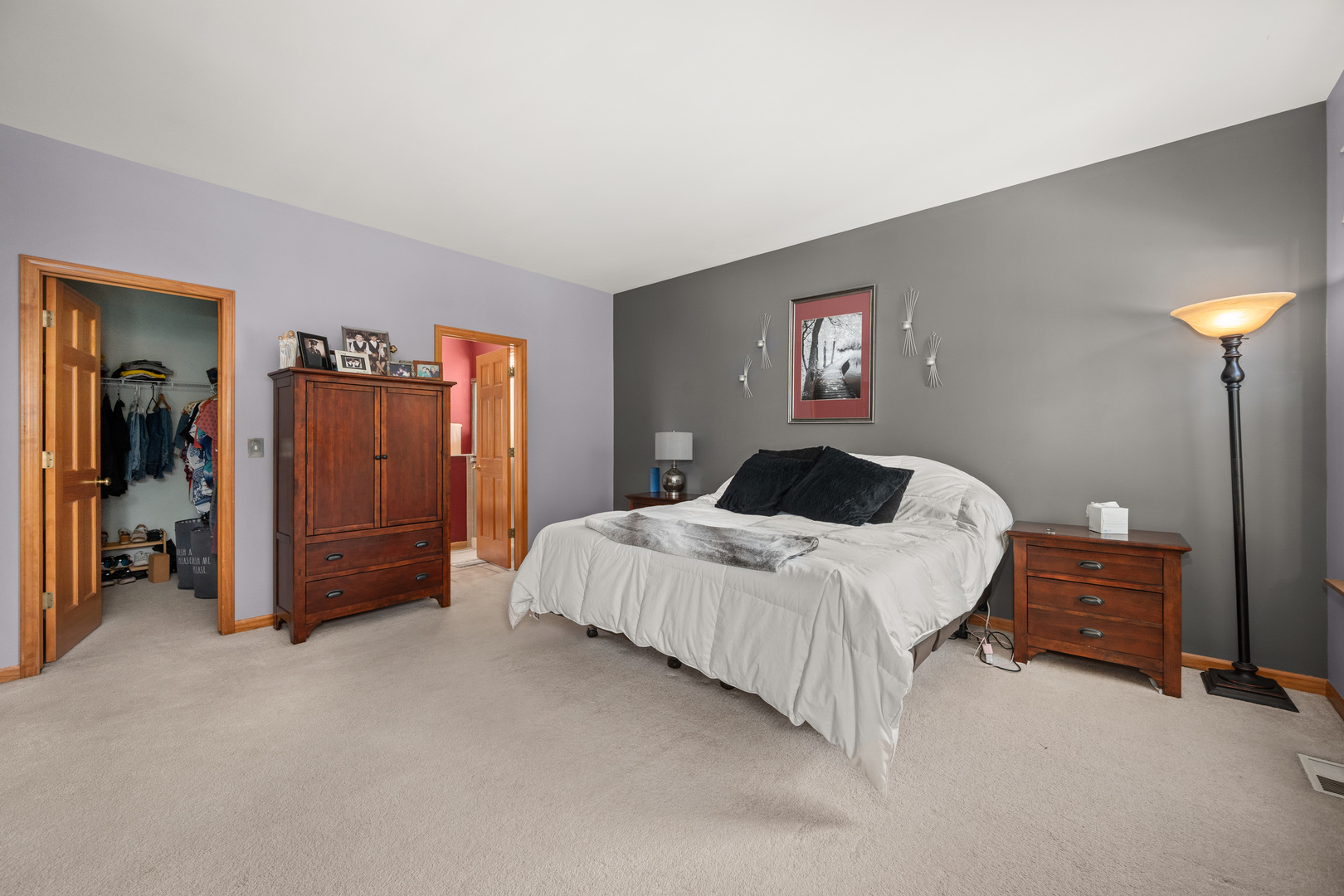 214 Stearn Drive Genoa, IL 60135 - Photo 9 of 24 a bedroom with a bed and a lamp