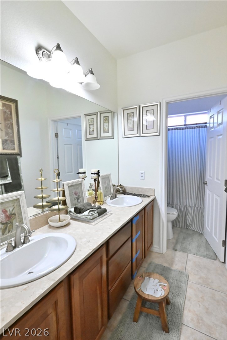 2729 Kildrummie Street Henderson, NV 89044 - Photo 34 of 42 Double vanities with ample counter space create a functional and pleasant bathroom environment.