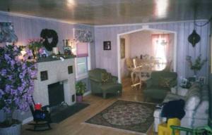 2 Fairgrounds Road Gilbert, PA 18331 - Photo 1 of 6 a living room with furniture and a fireplace