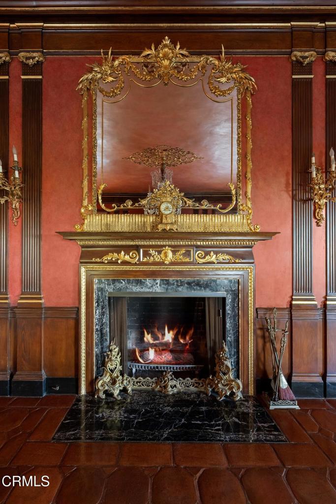 262 South San Rafael Avenue Pasadena, CA 91105 - Photo 23 of 49 a fireplace with a vase on top of it