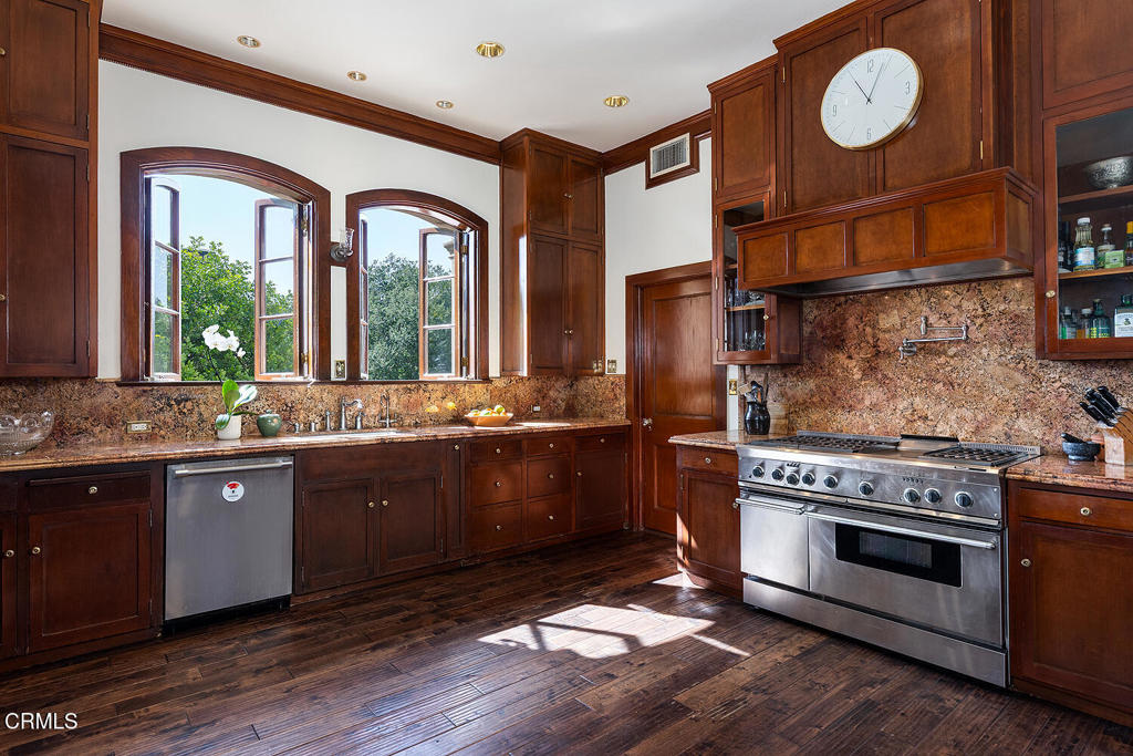 262 South San Rafael Avenue Pasadena, CA 91105 - Photo 25 of 49 a large kitchen with granite countertop a stove and a sink