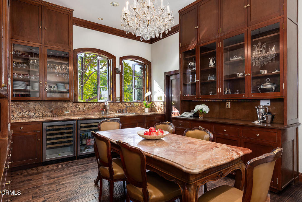 262 South San Rafael Avenue Pasadena, CA 91105 - Photo 26 of 49 a dinning table and chairs in a kitchen
