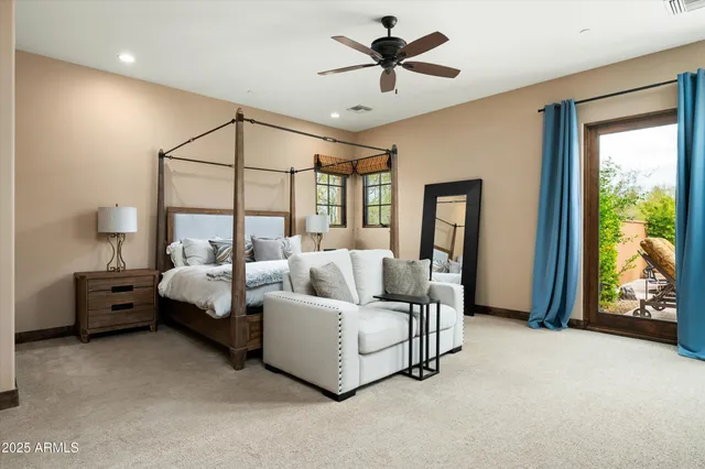 a bed room with a bed and a chandelier