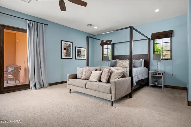 a bed room with a bed and a couch