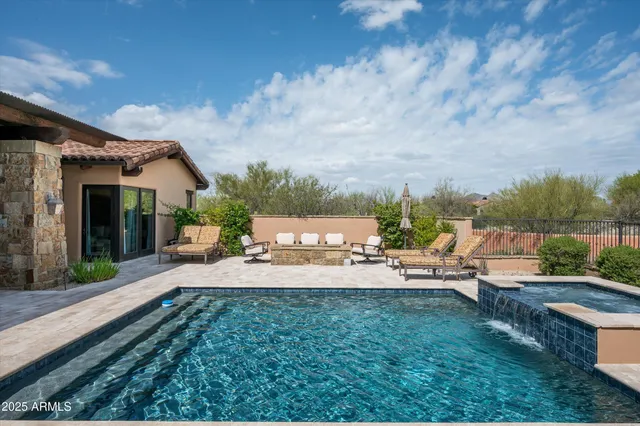 a view of a backyard with sitting area