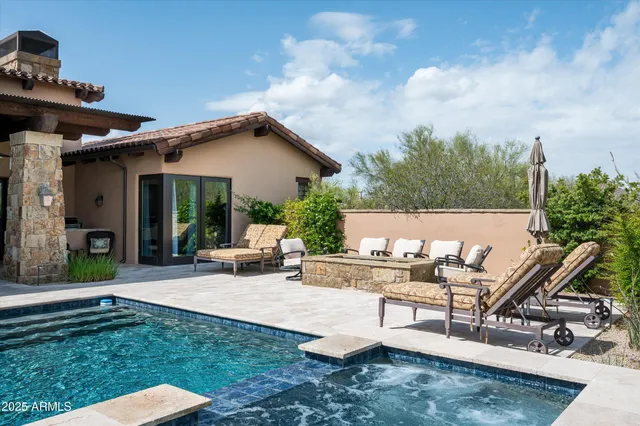 a view of a house with backyard sitting area and garden