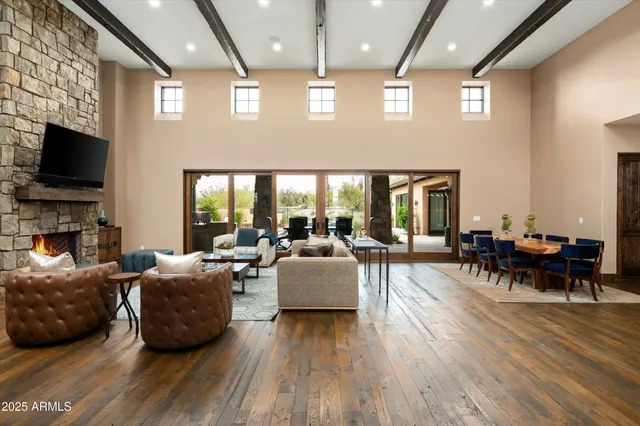 a living room with fireplace furniture and a flat screen tv