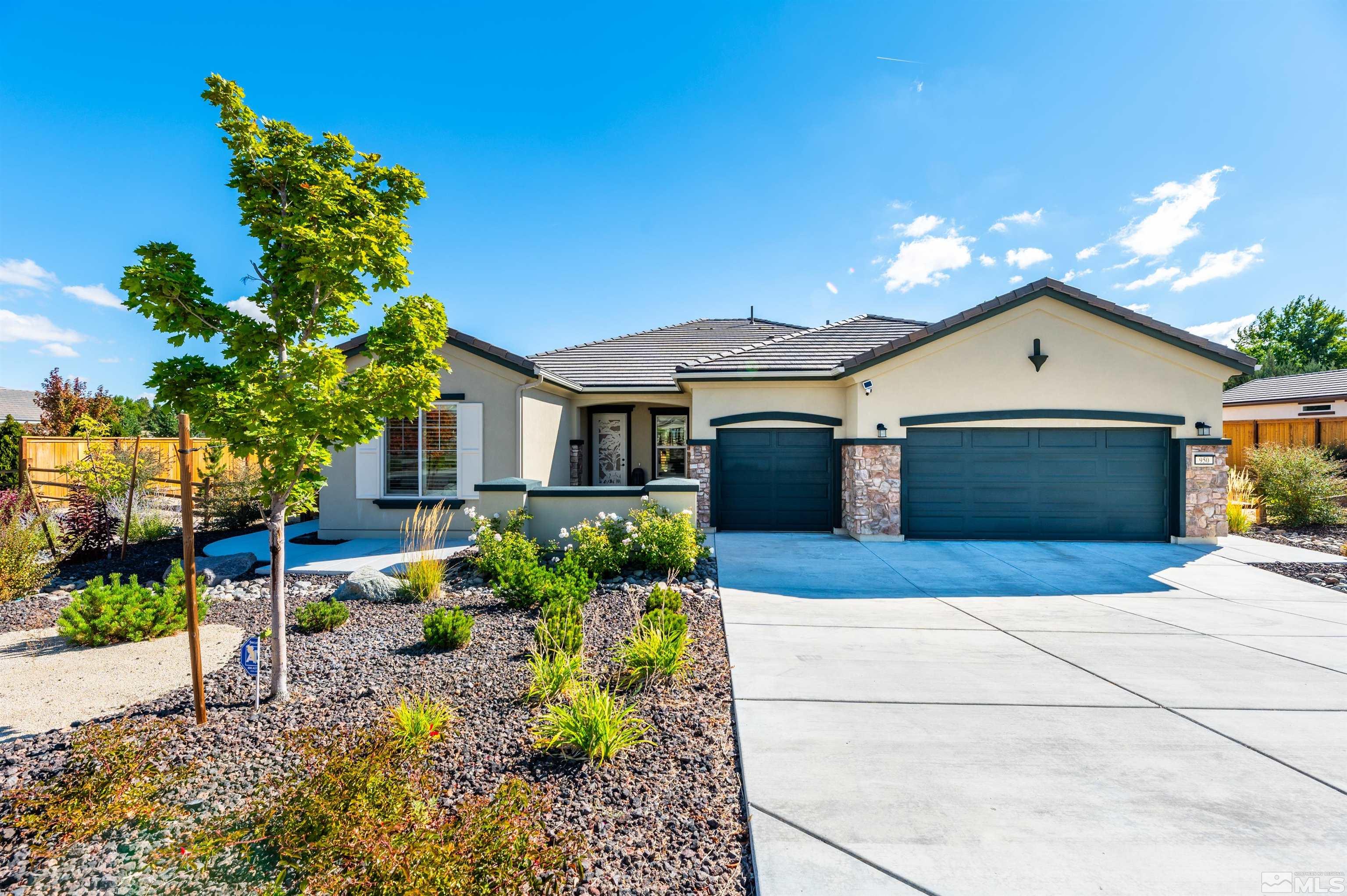 950 Broderick Trail Reno, NV 89523 - Photo 1 of 39 a front view of a house with a yard and a garden