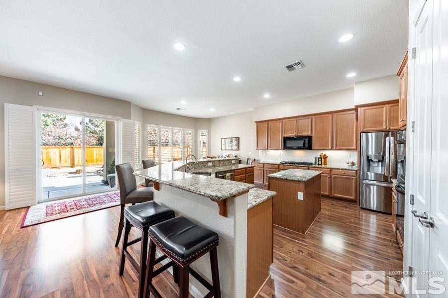 950 Broderick Trail Reno, NV 89523 - Photo 12 of 39 a large kitchen with a table and chairs in it
