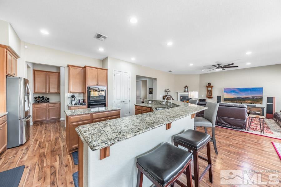 950 Broderick Trail Reno, NV 89523 - Photo 15 of 39 a large kitchen with lots of counter space and stainless steel appliances
