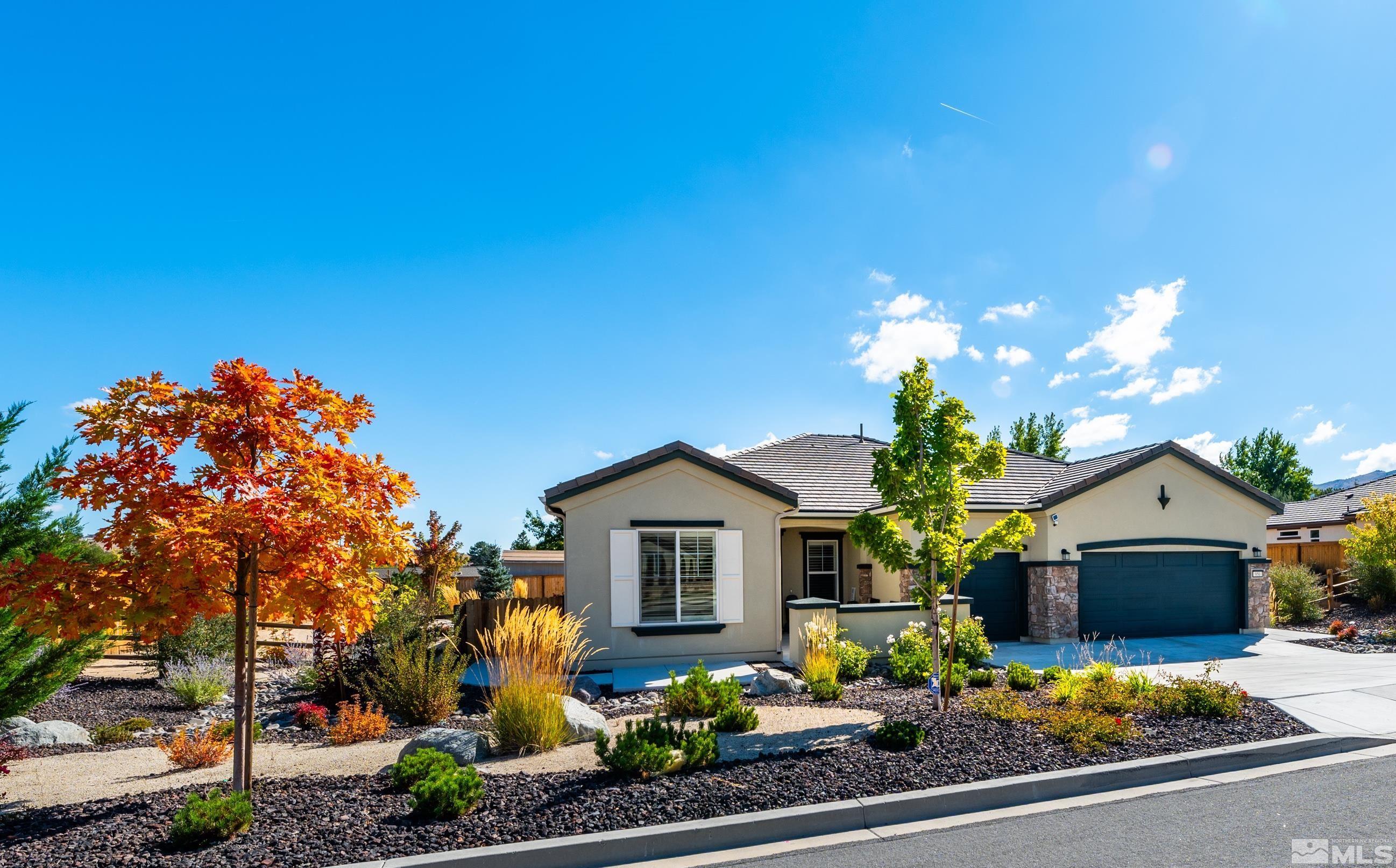 950 Broderick Trail Reno, NV 89523 - Photo 3 of 39 a front view of a house with a yard