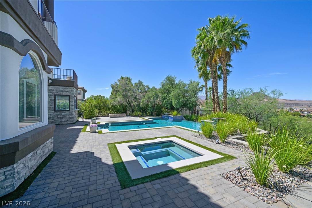 6 Rue Du Ville Henderson, NV 89011 - Photo 78 of 99 This outdoor oasis features a refreshing pool, relaxing spa, and abundant landscaping.