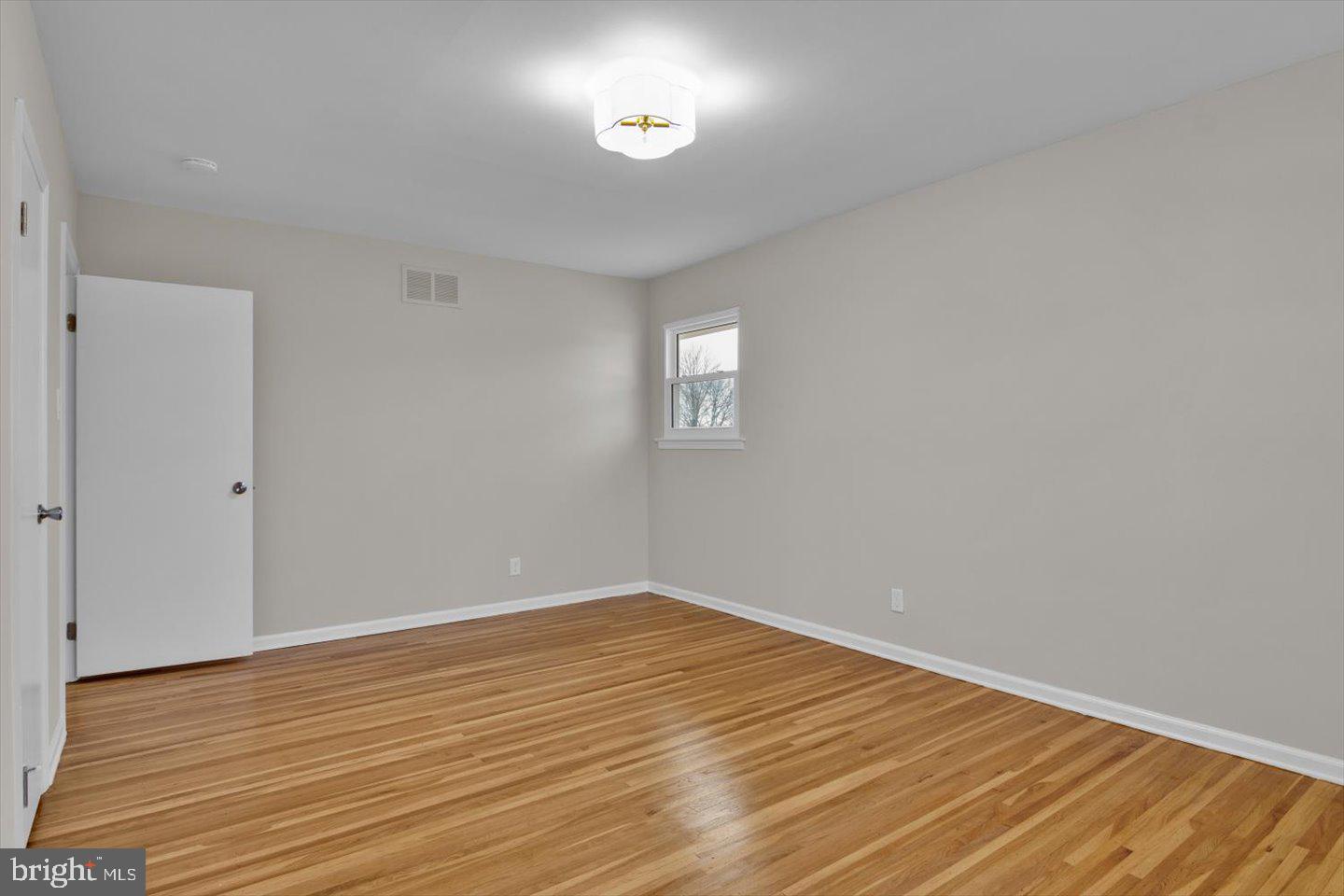 800 Marlowe Road Cherry Hill, NJ 08003 - Photo 28 of 55 a view of an empty room with wooden floor and a window