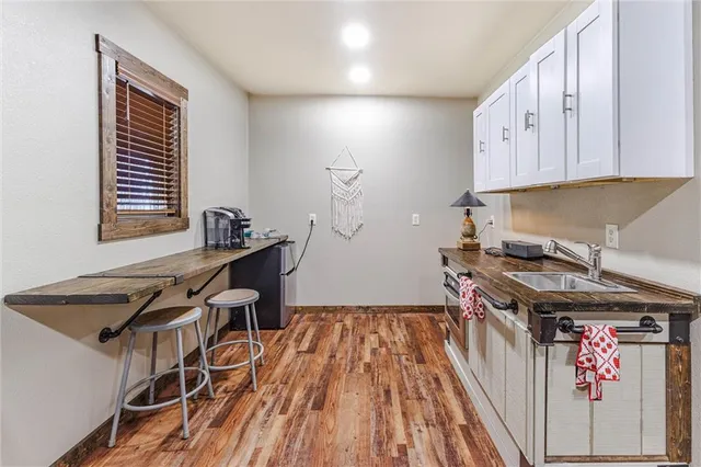 a kitchen that has a lot of cabinets in it