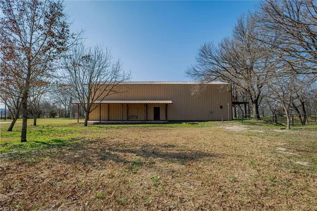 a house with trees in front of it
