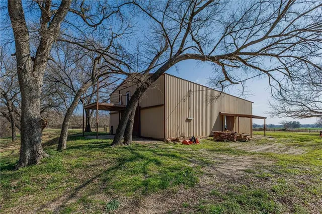 a backyard of a house with lots of green space