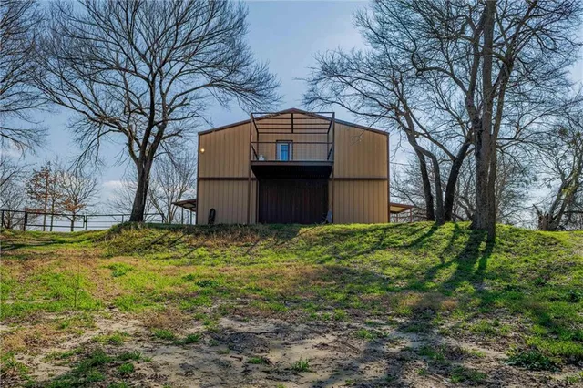 a house view with a backyard space
