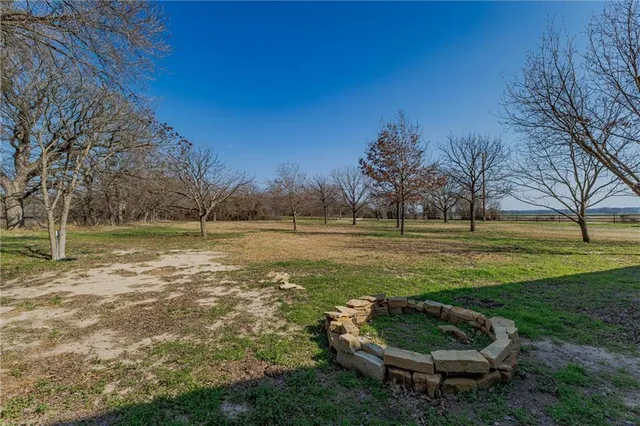a view of a backyard of the house