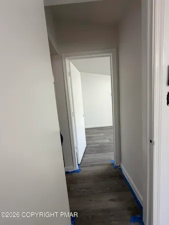 a view of front door with wooden floor