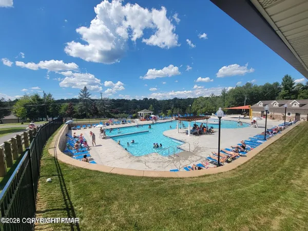 a view of a swimming pool with a lounge chairs