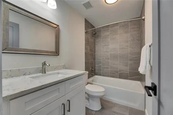 a bathroom with a bathtub and shower
